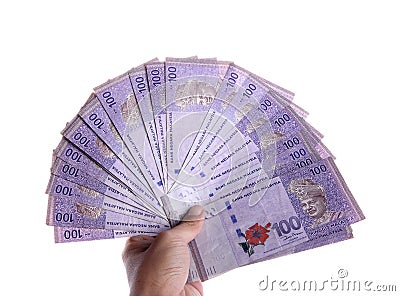 Ringgit of hundred nominal hand held Stock Photo