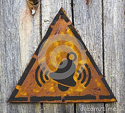 Ringing Bell Icon on Rusty Warning Sign. Stock Photo