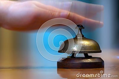 Ringing hotel reception bell Stock Photo