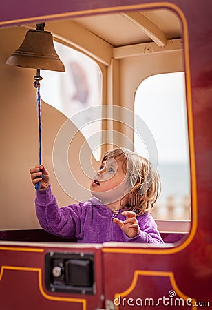 Ringing a train bell Stock Photo