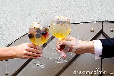 Ringing in the weekend. The perfect coktail in summer. Couple. Wedding Stock Photo