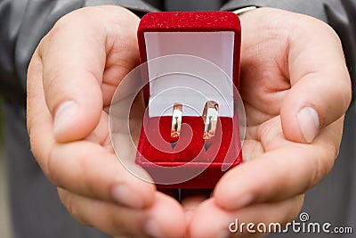 Rings in groom's hands Stock Photo