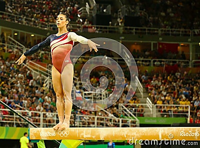 Olympic champion Ali Raisman of United States competing on the balance beam at women`s all-around gymnastics at Rio 2016 Olympics Editorial Stock Photo