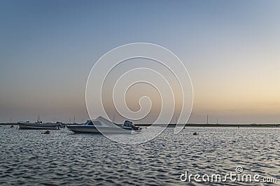 Rio Formosa boats floating at sunset Stock Photo