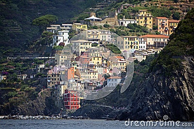 Riomaggiore, ancient village with colorful houses from the cinque terre, the famous tourism destination on the mediterranean sea, Stock Photo