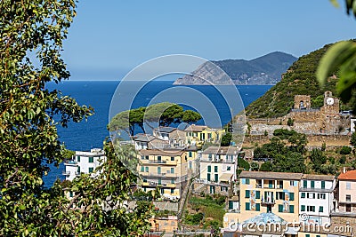 Natural panorama with coastal and ancient perched houses of the small town of Riomaggiore in Editorial Stock Photo