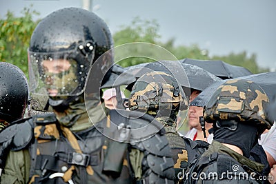 Riot police in full tactical gear ready to confront protesters in Belarus Editorial Stock Photo