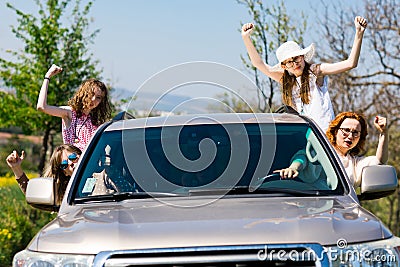 Rioters behind the wheel - female hooligans in the car Stock Photo