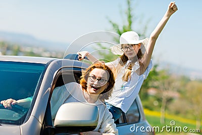 Rioters behind the wheel - female hooligans in the car Stock Photo