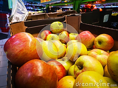 Ripe apples in a box for sale in a store Stock Photo