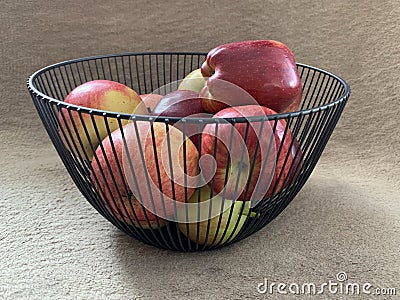 Ripe apples in a fruit bowl. Red, ripe apple in a metal vase Stock Photo