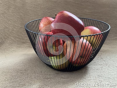 Ripe apples in a fruit bowl. Red, ripe apple in a metal vase Stock Photo