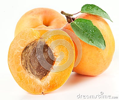 Ripe apricots with apricot leaf on the white background Stock Photo