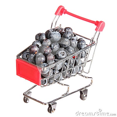 Ripe blueberries in shopping cart isolated. concept. Stock Photo