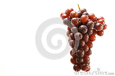 Ripe bunch of red grapes isolated on white background Stock Photo