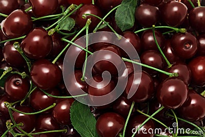 Ripe cherry with green leaves. Background Stock Photo