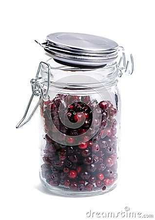Ripe cowberry in glass jar. Stock Photo