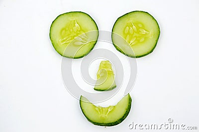 The ripe cucumber cutt roll with disine isolated in the white background Stock Photo