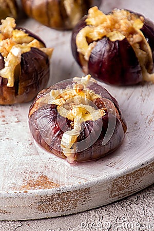 Ripe figs baked with cow's-milk cheese brie and camambert Stock Photo