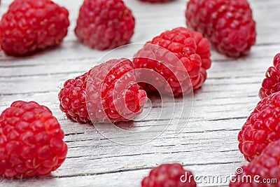 Ripe fresh raspberries on a wooden background Stock Photo