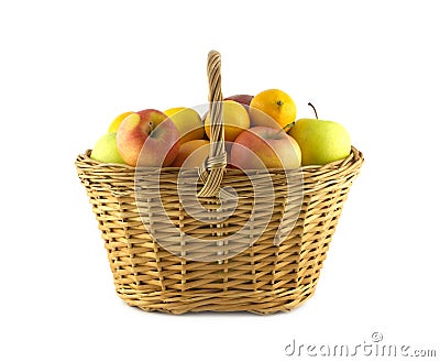 Ripe fruits and apples in wicker basket Stock Photo