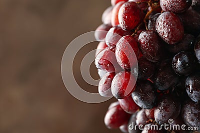 Ripe grape on brown background Stock Photo