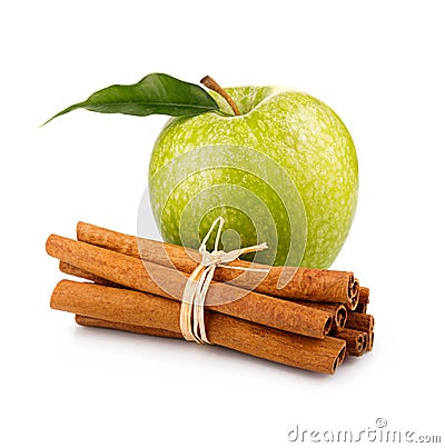 Ripe green apple with cinnamon sticks isolated Stock Photo