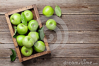 Green apples in wooden box Stock Photo