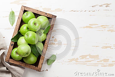 Green apples in wooden box Stock Photo