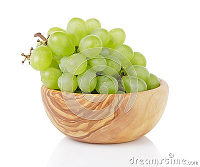 Ripe green grapes in wood bowl Stock Photo