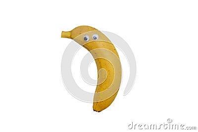 Ripe Kepok banana looks close up. Banana with eyes on white background. Funny banana. Stock Photo