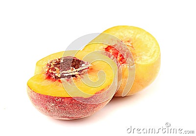 Ripe peach sliced in half Stock Photo