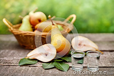 Ripe pears and fruit brandy alcohol drink Stock Photo