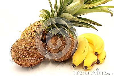 Ripe pineapple, bananas and coconuts closeup Stock Photo