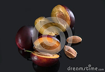 Ripe plums closeup on dark background Stock Photo