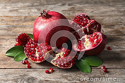 Ripe pomegranates and leaves Stock Photo