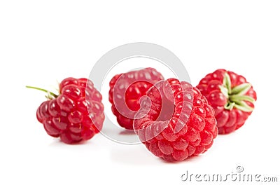 Ripe raspberries on white background. Red juicy berries closeup. Stock Photo