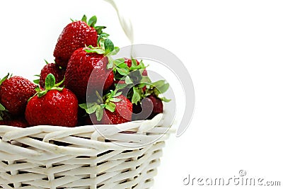 Ripe red strawberries in a white basket on white Stock Photo