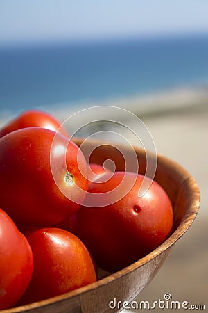 Ripe red tomatoes in a fruit bowl Stock Photo
