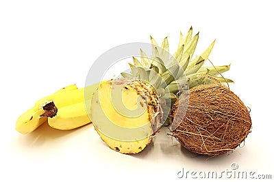 Ripe sliced pineapple, bananas and coconut Stock Photo