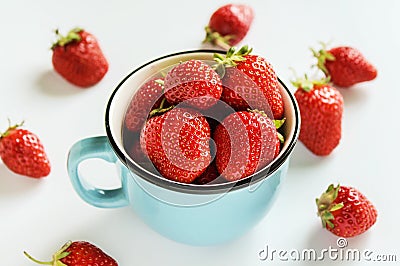 Ripe strawberries in a cup on a white background Stock Photo