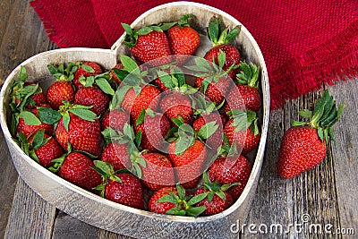 Ripe strawberries in heart dish Stock Photo
