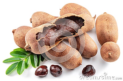 Ripe tamarind fruit, leaves and some tamarind seeds isolated on white background Stock Photo