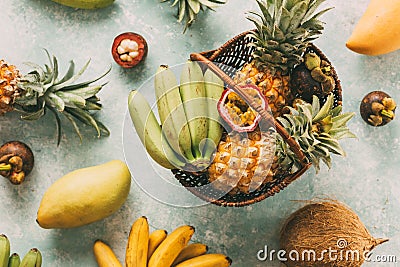 Ripe tropical fruits in a basket Stock Photo