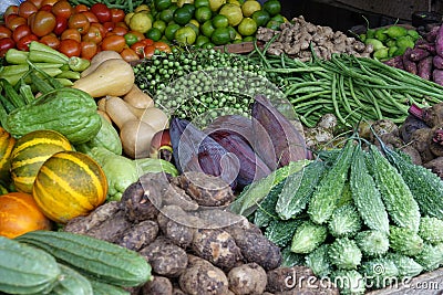 Ripe vegetables stacked on the counter at a local market of fruit and vegetable Stock Photo