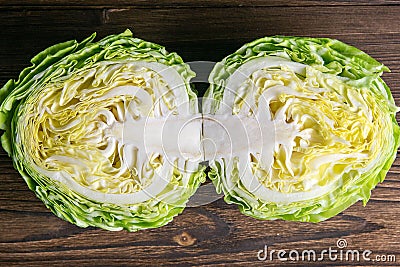 Ripe white cabbage on a wooden table. Top views, close-up Stock Photo