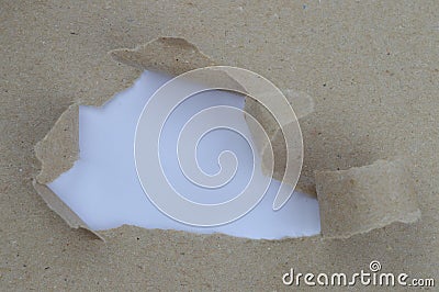 Ripped paper revealing white space for words Stock Photo