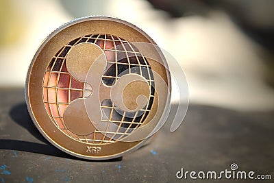 Physical Ripple Coin. Blockchain Cryptocurrency.Virtual Money Editorial Stock Photo