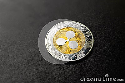 Ripple coin close-up on black background, cryptocurrency business and finance concept, copy space photo Editorial Stock Photo
