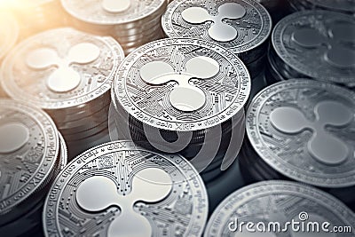 Ripple coins XRP in blurry closeup with sun flare. Editorial Stock Photo